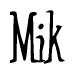 The image is a stylized text or script that reads 'Mik' in a cursive or calligraphic font.