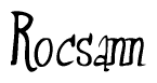 The image is a stylized text or script that reads 'Rocsann' in a cursive or calligraphic font.