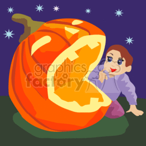 Child crawling next to a huge pumpkin on Halloween night