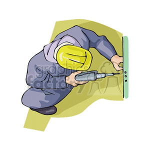 Man in a hardhat using a drill
