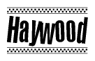 The image is a black and white clipart of the text Haywood in a bold, italicized font. The text is bordered by a dotted line on the top and bottom, and there are checkered flags positioned at both ends of the text, usually associated with racing or finishing lines.