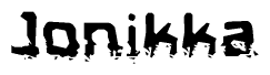 This nametag says Jonikka, and has a static looking effect at the bottom of the words. The words are in a stylized font.