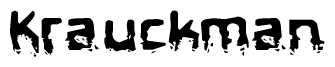 This nametag says Krauckman, and has a static looking effect at the bottom of the words. The words are in a stylized font.