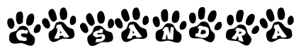 The image shows a row of animal paw prints, each containing a letter. The letters spell out the word Casandra within the paw prints.