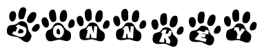 The image shows a series of animal paw prints arranged horizontally. Within each paw print, there's a letter; together they spell Donnkey