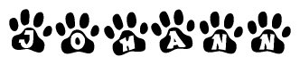 The image shows a row of animal paw prints, each containing a letter. The letters spell out the word Johann within the paw prints.