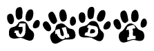 The image shows a series of animal paw prints arranged in a horizontal line. Each paw print contains a letter, and together they spell out the word Judi.