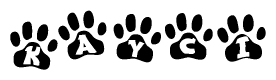 The image shows a row of animal paw prints, each containing a letter. The letters spell out the word Kayci within the paw prints.