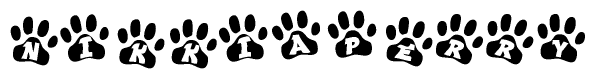 The image shows a row of animal paw prints, each containing a letter. The letters spell out the word Nikkiaperry within the paw prints.