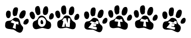 The image shows a series of animal paw prints arranged in a horizontal line. Each paw print contains a letter, and together they spell out the word Tonette.