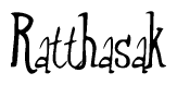 The image is a stylized text or script that reads 'Ratthasak' in a cursive or calligraphic font.
