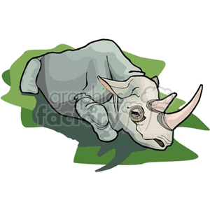 The clipart image features a cartoon of a rhinoceros lying down on a green surface, which gives the impression of grass. The rhino is depicted in a relaxed or resting posture, and it seems to be in a peaceful state, possibly suggesting that it is sleeping or simply taking a break.