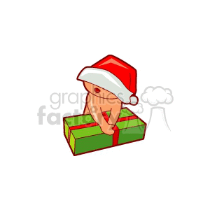 A cute baby wearing a Santa hat peeking over a large green gift wrapped with a red ribbon.