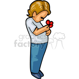 A Young Boy in Blue Holding and Looking at some Red Berries