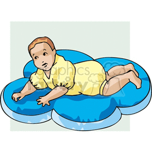 A baby laying on a puffy mat