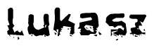 The image contains the word Lukasz in a stylized font with a static looking effect at the bottom of the words