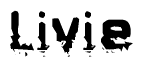 This nametag says Livie, and has a static looking effect at the bottom of the words. The words are in a stylized font.