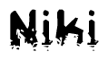 This nametag says Niki, and has a static looking effect at the bottom of the words. The words are in a stylized font.