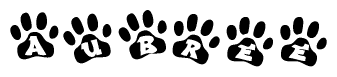 The image shows a row of animal paw prints, each containing a letter. The letters spell out the word Aubree within the paw prints.