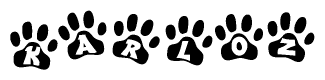 The image shows a series of animal paw prints arranged in a horizontal line. Each paw print contains a letter, and together they spell out the word Karloz.