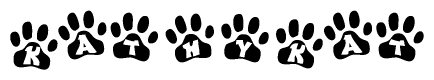 The image shows a series of animal paw prints arranged in a horizontal line. Each paw print contains a letter, and together they spell out the word Kathykat.