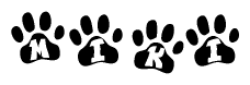 The image shows a series of animal paw prints arranged in a horizontal line. Each paw print contains a letter, and together they spell out the word Miki.