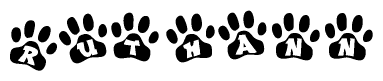 The image shows a row of animal paw prints, each containing a letter. The letters spell out the word Ruthann within the paw prints.