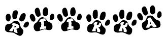 The image shows a series of animal paw prints arranged horizontally. Within each paw print, there's a letter; together they spell Riikka