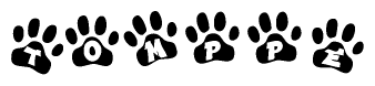 The image shows a series of animal paw prints arranged horizontally. Within each paw print, there's a letter; together they spell Tomppe