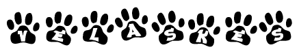 The image shows a row of animal paw prints, each containing a letter. The letters spell out the word Velaskes within the paw prints.
