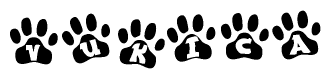 The image shows a series of animal paw prints arranged in a horizontal line. Each paw print contains a letter, and together they spell out the word Vukica.