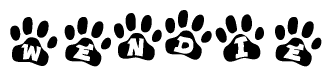 The image shows a series of animal paw prints arranged in a horizontal line. Each paw print contains a letter, and together they spell out the word Wendie.