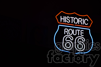 Neon sign of Historic Route 66 against a dark background, featuring red, white, and blue colors.