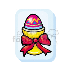 A colorful Easter egg in a yellow egg holder cup, adorned with a red bow.