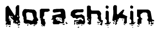 This nametag says Norashikin, and has a static looking effect at the bottom of the words. The words are in a stylized font.