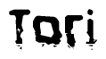 This nametag says Tori, and has a static looking effect at the bottom of the words. The words are in a stylized font.