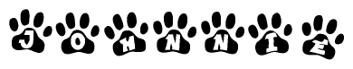 The image shows a series of animal paw prints arranged in a horizontal line. Each paw print contains a letter, and together they spell out the word Johnnie.