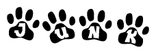 The image shows a series of animal paw prints arranged in a horizontal line. Each paw print contains a letter, and together they spell out the word Junk.