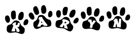 The image shows a series of animal paw prints arranged in a horizontal line. Each paw print contains a letter, and together they spell out the word Karyn.