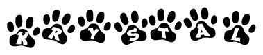 The image shows a series of animal paw prints arranged in a horizontal line. Each paw print contains a letter, and together they spell out the word Krystal.