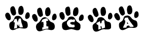 The image shows a series of animal paw prints arranged in a horizontal line. Each paw print contains a letter, and together they spell out the word Micha.