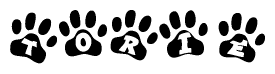 The image shows a row of animal paw prints, each containing a letter. The letters spell out the word Torie within the paw prints.