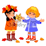 The clipart image depicts two animated children enjoying the autumn season. On the left, a child is dressed in an orange dress with leaves and flowers in her hair, holding a maple leaf. On the right, a child is wearing a blue coat and smiling with arms open. There are autumn leaves scattered at their feet.
