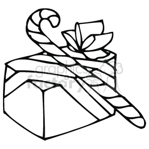 The image shows a black and white clipart of a Christmas gift. The gift is wrapped with a ribbon and has a bow on top. Beside the gift, there is a candy cane, adding to the festive holiday theme of the image.