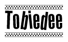 The image is a black and white clipart of the text Tobiedee in a bold, italicized font. The text is bordered by a dotted line on the top and bottom, and there are checkered flags positioned at both ends of the text, usually associated with racing or finishing lines.
