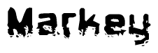 This nametag says Markey, and has a static looking effect at the bottom of the words. The words are in a stylized font.