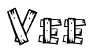 The image contains the name Vee written in a decorative, stylized font with a hand-drawn appearance. The lines are made up of what appears to be planks of wood, which are nailed together