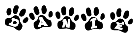 The image shows a series of animal paw prints arranged in a horizontal line. Each paw print contains a letter, and together they spell out the word Danie.