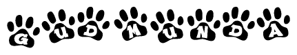 The image shows a series of animal paw prints arranged horizontally. Within each paw print, there's a letter; together they spell Gudmunda