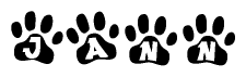 The image shows a row of animal paw prints, each containing a letter. The letters spell out the word Jann within the paw prints.